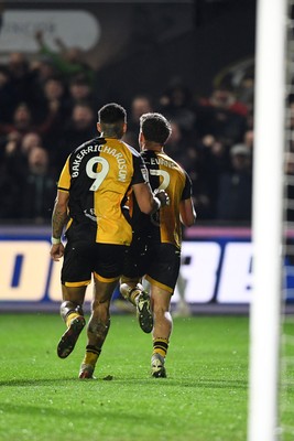 030326 - Newport County v Tranmere Rovers - Sky Bet League 2 - Cameron Evans of Newport County celebrates scoring a goal with team mates