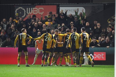 030326 - Newport County v Tranmere Rovers - Sky Bet League 2 - Cameron Evans of Newport County celebrates scoring a goal with team mates