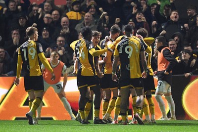 030326 - Newport County v Tranmere Rovers - Sky Bet League 2 - Cameron Evans of Newport County celebrates scoring a goal with team mates
