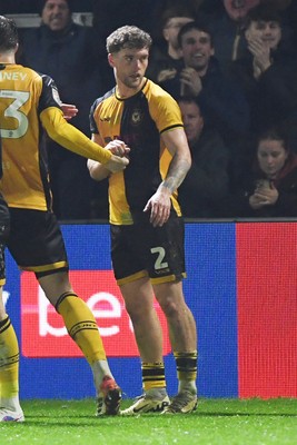 030326 - Newport County v Tranmere Rovers - Sky Bet League 2 - Cameron Evans of Newport County celebrates scoring a goal with team mates