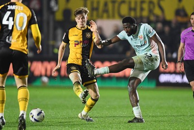 030326 - Newport County v Tranmere Rovers - Sky Bet League 2 - Tom Davies of Newport County is challenged by Nohan Kenneh of Tranmere