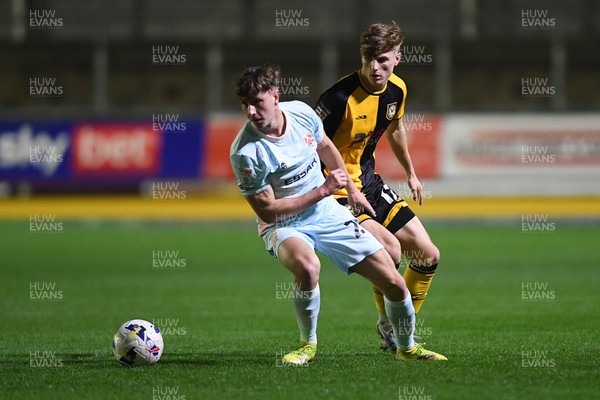 030326 - Newport County v Tranmere Rovers - Sky Bet League 2 - Tom Davies of Newport County is challenged by James Plant of Tranmere