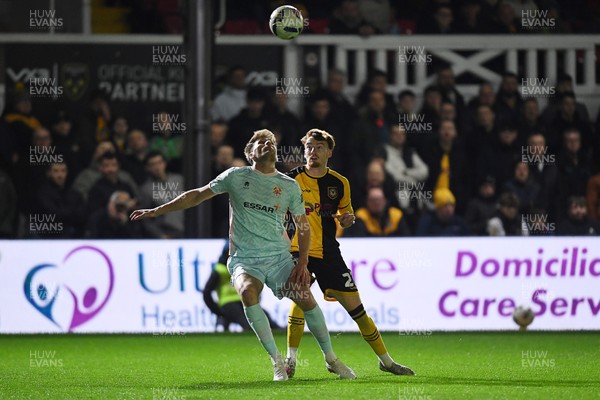 030326 - Newport County v Tranmere Rovers - Sky Bet League 2 - Michael Spellman of Newport County is challenged by Patrick Brough of Tranmere