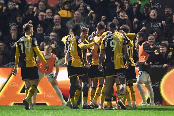 030326 - Newport County v Tranmere Rovers - Sky Bet League 2 - Cameron Evans of Newport County celebrates scoring a goal with team mates