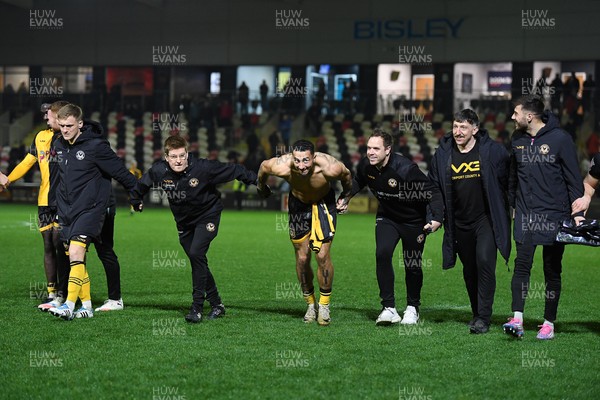 030326 - Newport County v Tranmere Rovers - Sky Bet League 2 - Newport players and staff celebrate the win at full time