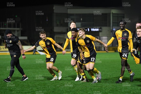 030326 - Newport County v Tranmere Rovers - Sky Bet League 2 - Newport players and staff celebrate the win at full time