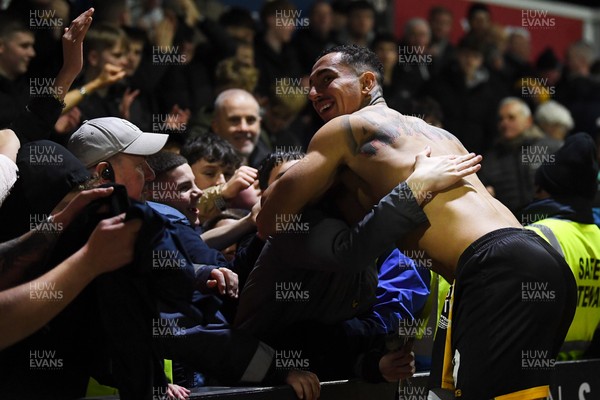 030326 - Newport County v Tranmere Rovers - Sky Bet League 2 - Courtney Baker-Richardson of Newport County celebrates with fans at full time
