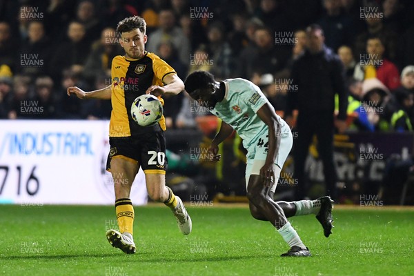 030326 - Newport County v Tranmere Rovers - Sky Bet League 2 - Ben Lloyd of Newport County is challenged by Nohan Kenneh of Tranmere