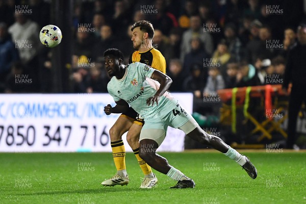 030326 - Newport County v Tranmere Rovers - Sky Bet League 2 - Ben Lloyd of Newport County is challenged by Nohan Kenneh of Tranmere
