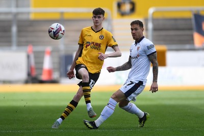 030525 - Newport County v Tranmere Rovers - Sky Bet League 2 - Joe Thomas of Newport County is challenged by Kieron Morris of Tranmere Rovers