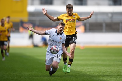 030525 - Newport County v Tranmere Rovers - Sky Bet League 2 - Oliver Greaves of Newport County is challenged by Chris Merrie of Tranmere Rovers