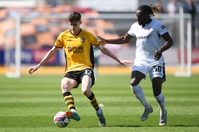 030525 - Newport County v Tranmere Rovers - Sky Bet League 2 - Joe Thomas of Newport County is challenged by Omari Patrick of Tranmere Rovers