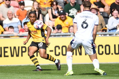 030525 - Newport County v Tranmere Rovers - Sky Bet League 2 - Moses Alexander-Walker of Newport County is challenged by Jordan Turnbull of Tranmere Rovers
