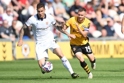 030525 - Newport County v Tranmere Rovers - Sky Bet League 2 - Shane McLoughlin of Newport County is challenged by Kieron Morris of Tranmere Rovers