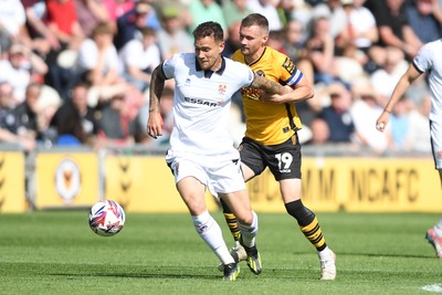 030525 - Newport County v Tranmere Rovers - Sky Bet League 2 - Shane McLoughlin of Newport County is challenged by Kieron Morris of Tranmere Rovers
