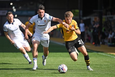 030525 - Newport County v Tranmere Rovers - Sky Bet League 2 - Tom Davies of Newport County is challenged by Josh Hawkes of Tranmere Rovers