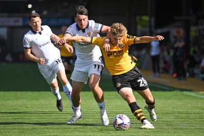 030525 - Newport County v Tranmere Rovers - Sky Bet League 2 - Tom Davies of Newport County is challenged by Josh Hawkes of Tranmere Rovers