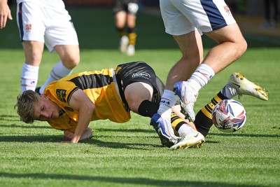 030525 - Newport County v Tranmere Rovers - Sky Bet League 2 - Tom Davies of Newport County is challenged by Josh Hawkes of Tranmere Rovers