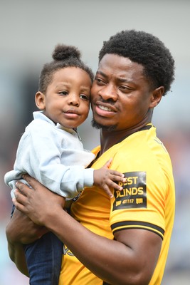 030525 - Newport County v Tranmere Rovers - Sky Bet League 2 - Bobby Kamwa of Newport County walks out with family at the start boo the match