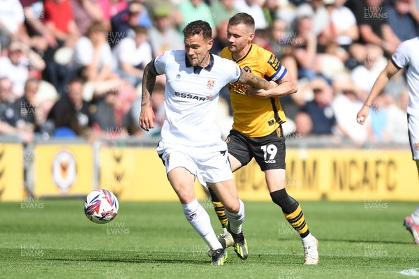 030525 - Newport County v Tranmere Rovers - Sky Bet League 2 - Shane McLoughlin of Newport County is challenged by Kieron Morris of Tranmere Rovers