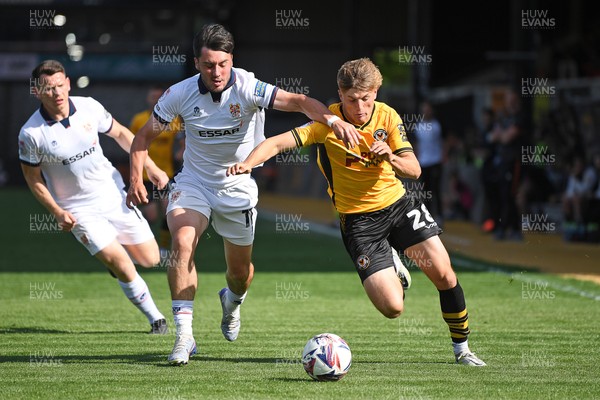 030525 - Newport County v Tranmere Rovers - Sky Bet League 2 - Tom Davies of Newport County is challenged by Josh Hawkes of Tranmere Rovers