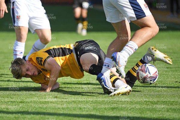 030525 - Newport County v Tranmere Rovers - Sky Bet League 2 - Tom Davies of Newport County is challenged by Josh Hawkes of Tranmere Rovers