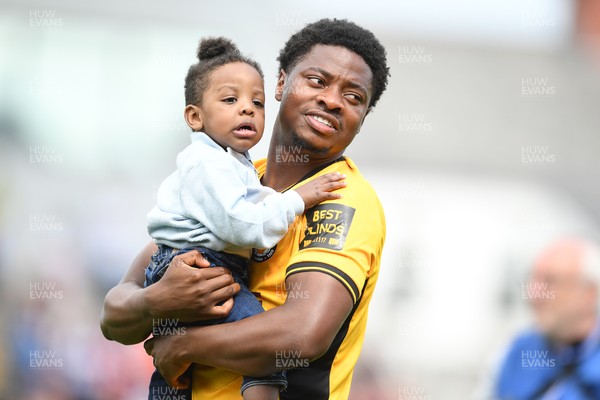 030525 - Newport County v Tranmere Rovers - Sky Bet League 2 - Bobby Kamwa of Newport County walks out with family at the start boo the match