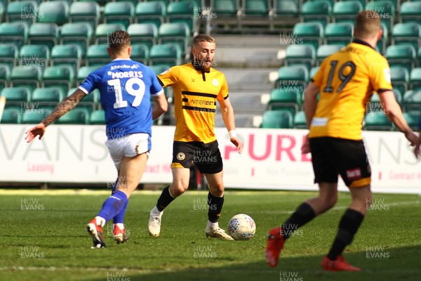 060419 Newport County v Tranmere Rovers - Sky Bet League 2 - Dan Butler of Newport County clears under pressure from Kieron Morris of Tranmere Rovers
