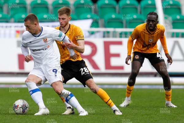 130424 - Newport County v Tranmere Rovers - Sky Bet League 2 -  Luke Norris of Tranmere Rovers and Matthew Baker of Newport County