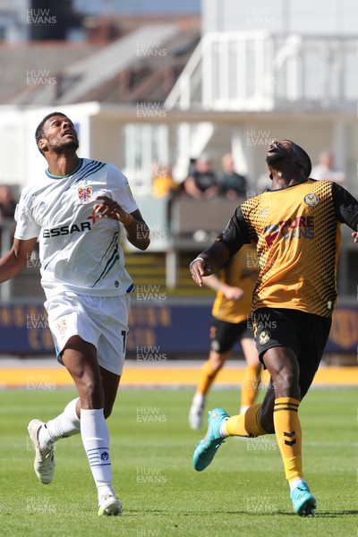 200822 - Newport County v Tranmere Rovers - Sky Bet League 2 - Kyle Jameson of Tranmere Rovers and Omar Bogle of Newport County chase a high ball