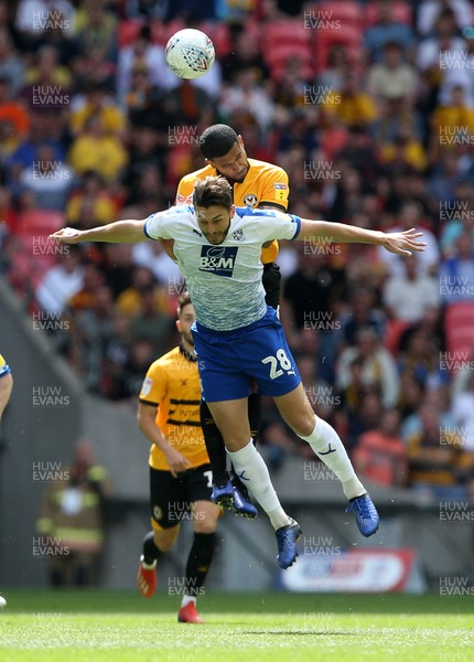 250519 - Newport County v Tranmere Rovers - SkyBet League Two Play-off Final - Oliver Banks of Tranmere Rovers and Joss Labadie of Newport County go up for the ball