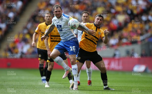 250519 - Newport County v Tranmere Rovers - SkyBet League Two Play-off Final - Joss Labadie of Newport County is challenged by James Norwood of Tranmere Rovers