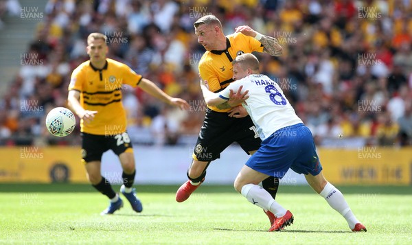 250519 - Newport County v Tranmere Rovers - SkyBet League Two Play-off Final - Scot Bennett of Newport County is challenged by Jay Harris of Tranmere Rovers