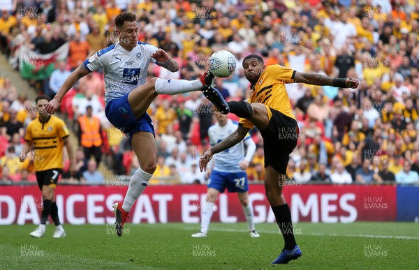 250519 - Newport County v Tranmere Rovers - SkyBet League Two Play-off Final - Joss Labadie of Newport County is challenged by Jake Caprice of Tranmere Rovers