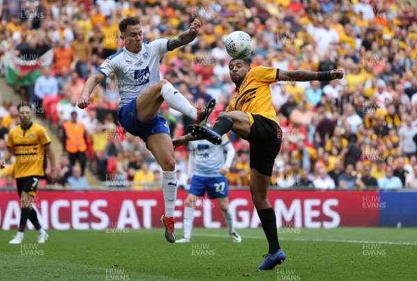250519 - Newport County v Tranmere Rovers - SkyBet League Two Play-off Final - Joss Labadie of Newport County is challenged by Jake Caprice of Tranmere Rovers