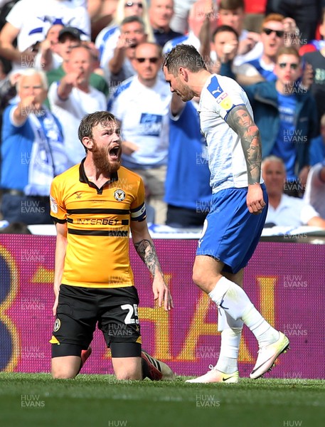 250519 - Newport County v Tranmere Rovers - SkyBet League Two Play-off Final - Mark O'Brien of Newport County receives a red card for his tackle on James Norwood of Tranmere Rovers