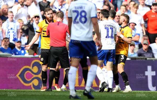 250519 - Newport County v Tranmere Rovers - SkyBet League Two Play-off Final - Mark O'Brien of Newport County receives a red card for his tackle on James Norwood of Tranmere Rovers