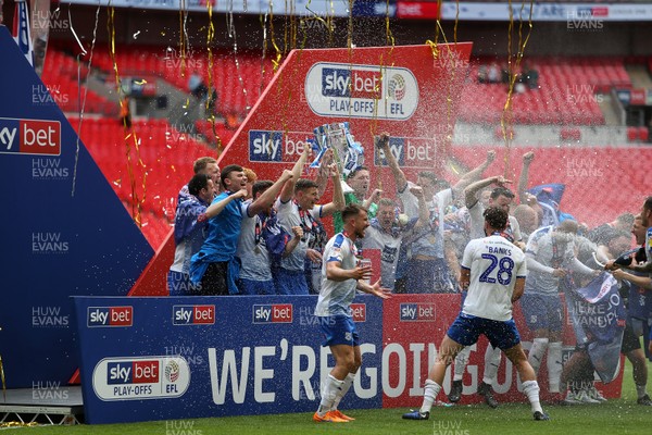 250519 - Newport County v Tranmere Rovers - SkyBet League Two Play-off Final - Tranmere celebrate winning with the trophy