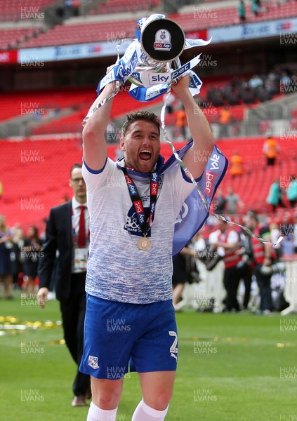 250519 - Newport County v Tranmere Rovers - SkyBet League Two Play-off Final - Adam Buxton of Tranmere Rovers celebrates with the trophy in front of the fans