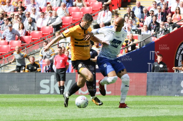 250519 - Newport County v Tranmere Rovers, Sky Bet League 2 Play-Off Final - Padraig Amond of Newport County takes on Jake Caprice of Tranmere Rovers