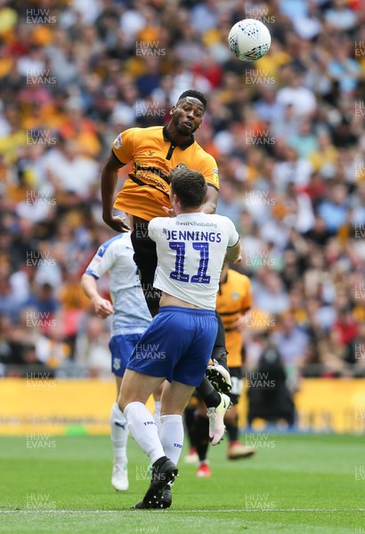 250519 - Newport County v Tranmere Rovers, Sky Bet League 2 Play-Off Final - Jamille Matt of Newport County heads past Connor Jennings of Tranmere Rovers