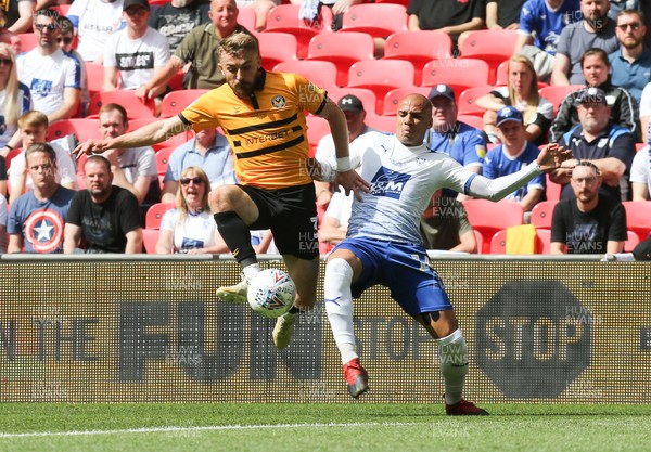 250519 - Newport County v Tranmere Rovers, Sky Bet League 2 Play-Off Final - Dan Butler of Newport County and Jake Caprice of Tranmere Rovers compete for the ball