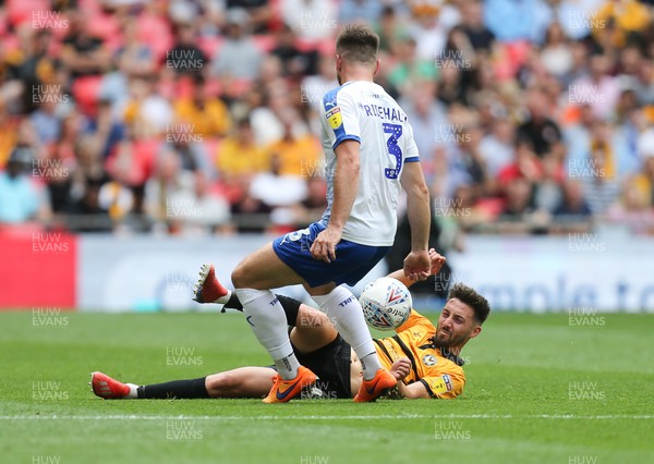 250519 - Newport County v Tranmere Rovers, Sky Bet League 2 Play-Off Final - Josh Sheehan of Newport County and Liam Ridehalgh of Tranmere Rovers compete for the ball