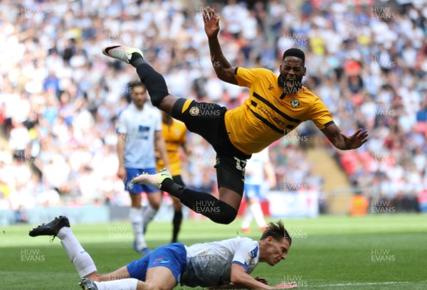 250519 - Newport County v Tranmere Rovers, Sky Bet League 2 Play-Off Final - Jamille Matt of Newport County is sent flying as he is tackled by Sid Nelson of Tranmere Rovers