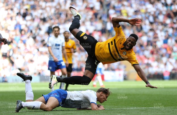 250519 - Newport County v Tranmere Rovers, Sky Bet League 2 Play-Off Final - Jamille Matt of Newport County is sent flying as he is tackled by Sid Nelson of Tranmere Rovers
