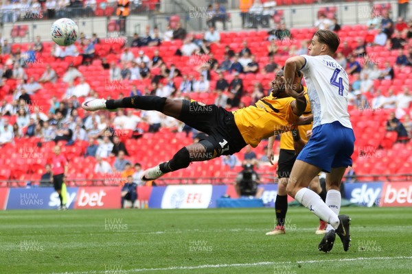 250519 - Newport County v Tranmere Rovers, Sky Bet League 2 Play-Off Final - Jamille Matt of Newport County tries to get a shot at goal past Sid Nelson of Tranmere Rovers