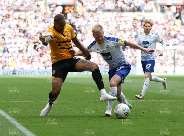 250519 - Newport County v Tranmere Rovers, Sky Bet League 2 Play-Off Final - Keanu Marsh-Brown of Newport County and David Perkins of Tranmere Rovers compete for the ball