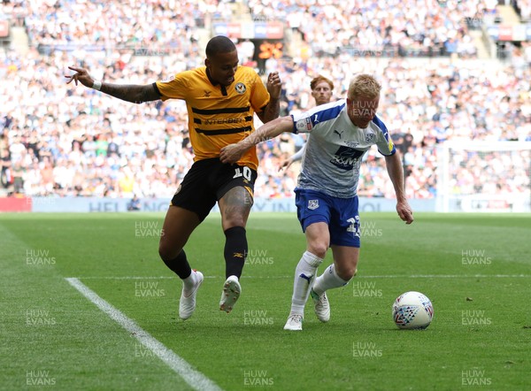 250519 - Newport County v Tranmere Rovers, Sky Bet League 2 Play-Off Final - Keanu Marsh-Brown of Newport County and David Perkins of Tranmere Rovers compete for the ball