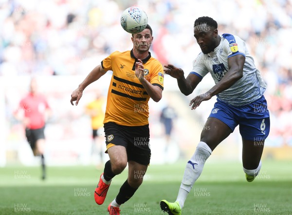 250519 - Newport County v Tranmere Rovers, Sky Bet League 2 Play-Off Final - Padraig Amond of Newport County and Emmanuel Monthe of Tranmere Rovers compete for the ball
