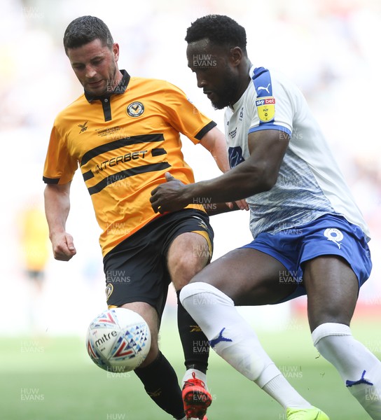 250519 - Newport County v Tranmere Rovers, Sky Bet League 2 Play-Off Final - Padraig Amond of Newport County and Emmanuel Monthe of Tranmere Rovers compete for the ball